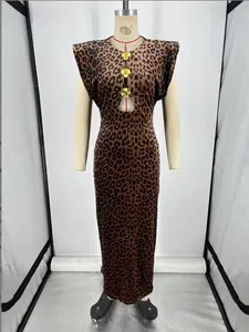 Detail of the leopard print dress featuring a keyhole cutout and gold shell buckles