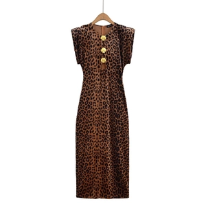 Detailed view of Y2K velvet leopard midi dress with gold shell buttons and shoulder pads