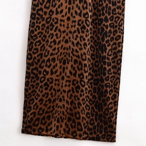 Detail shot of the velvet leopard print fabric with precise single-needle hem stitching