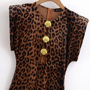 Detail of leopard velvet top with gold shell metal buckles and hollow-out front design