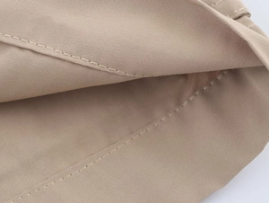Detail of khaki twill fabric and neat stitching with smooth lining on the suit pants
