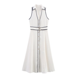 Sleeveless white polka dot maxi dress with lapel collar and contrast piping detail