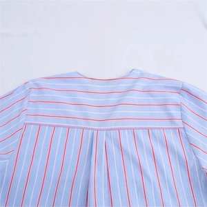 Blue and white striped shirt with red accents and zigzag stitching on the back yoke
