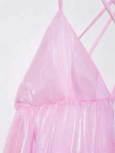 Detail of pink metallic textured crop top with pleated fabric and crisscross straps
