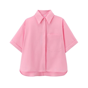 Close-up of pink poplin short-sleeve shirt detailing the collar, buttons, and XS size label