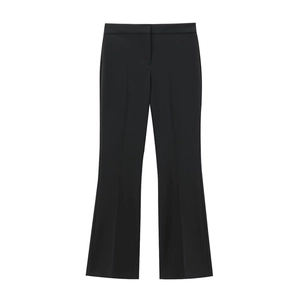 Close-up of high-waist black flare trousers featuring crisp center crease and sleek fabric