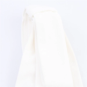 Detailed macro view of white pleated fabric texture for elegant summer bow dress