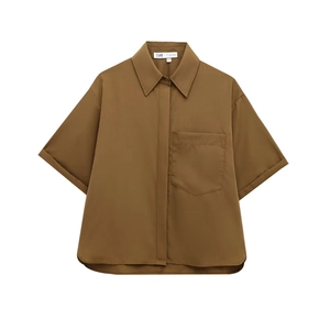Close-up of brown poplin shirt featuring front chest pocket and neat button placket