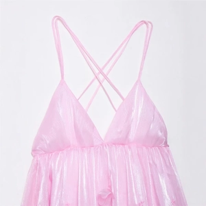 Chic pink pearlescent mini dress with V-neck, pleated details and crisscross straps