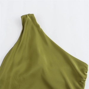 Detail of olive green satin dress featuring asymmetrical one-shoulder and elegant draping