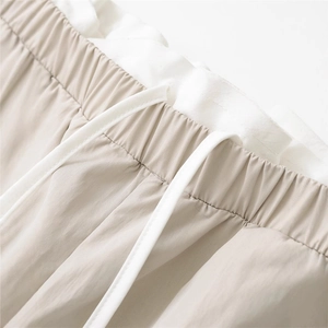 Minimalist light khaki loose wide leg pants with elastic drawstring waist detail