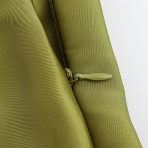 Detail of olive green dress showing high-quality twill fabric and hidden zipper closure