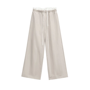 Women's light grey wide-leg trousers with drawstring elastic waist and ruffle details