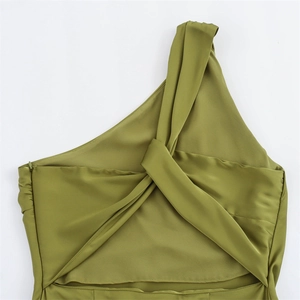 Detail view of olive green satin dress featuring shoulder knot and hidden side zipper