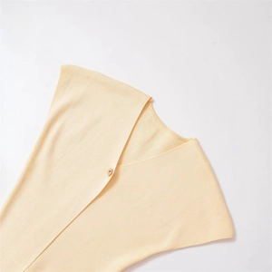 Minimalist cream yellow V-neck knit cardigan with ribbed texture and amber button detail