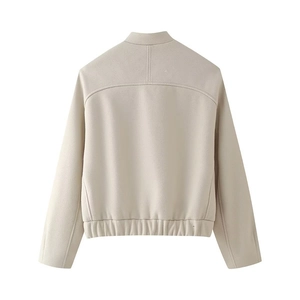 Detailed back view of cropped cream jacket showing horizontal stitching and elastic hem