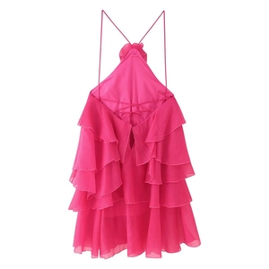 Detail of rose red halter neck dress with layered ruffles and delicate chiffon fabric texture