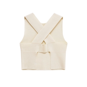 Detail of cross lace-up back design on a cream ribbed knit sleeveless top crop vest