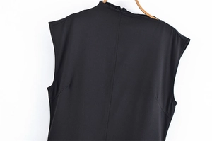 Close-up of black sleeveless dress back with mock neck and invisible zipper detail