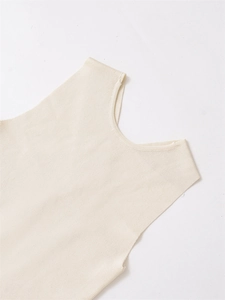 Detailed stitching and texture of this cream white knit vest made from fine fabric