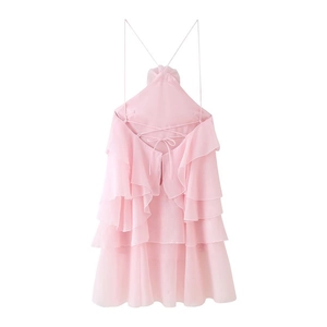 Detail view of pink ruffled summer dress with adjustable criss-cross back tie straps