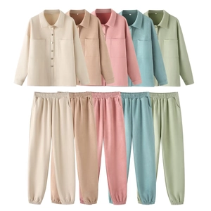 Detail view of colorful faux suede jacket and jogger pants sets with front pockets