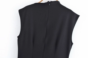 Detail view of the elegant black sleeveless dress with invisible back zipper and stand collar