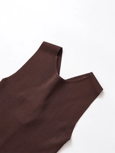 Detailed view of the dark brown rib-knit texture and U-neck stitching on this vest