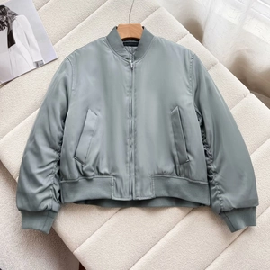 Detail of the sage green bomber jacket with smooth fabric, rib-knit collar and side pocket