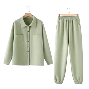 Detail view of sage green faux suede shirt jacket and matching elastic waist trousers