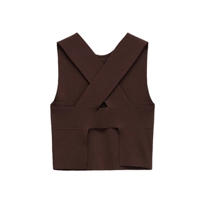 Close-up of ribbed knit texture on a dark brown sleeveless cropped top with cross back