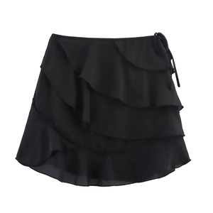 Mini-jupe noire à volants superposés pour femme avec détail de nœud latéral élégant