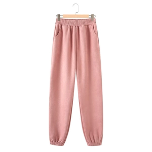Detail showing pink suede high waist joggers with elastic waistband and side pockets