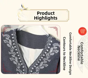 Detail of V-neckline on denim vest featuring elegant white plant embroidery and soft lining