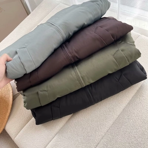 Women's loose stand collar bomber jackets in four colors stacked on beige textured background