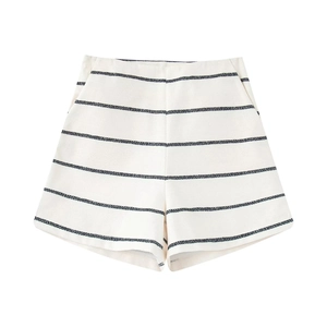 Detailed close-up of high-waist striped shorts with tweed texture and side pockets