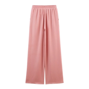 Detail view of pink high-waisted wide-leg trousers with pleated texture fabric