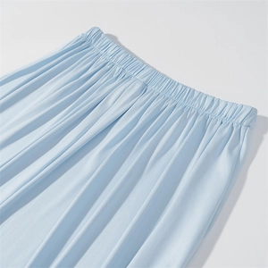 Detail of light blue tiered skirt showing elastic waistband and pleated chiffon texture