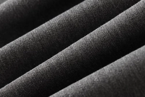 Gros plan sur la texture du tissu gris anthracite haute densité et tissage fin