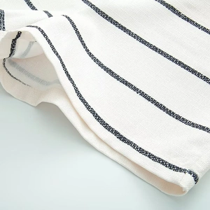 Detailed close-up showing the premium texture and striped pattern of the knitted fabric set