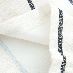 Close-up of high-quality striped knit fabric showing detailed stitching and soft texture