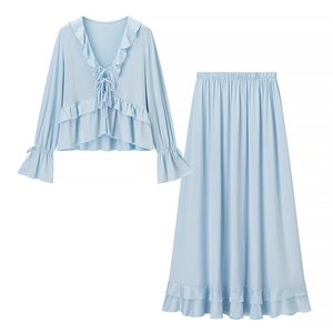 Women's light blue two-piece set featuring ruffled V-neck top and tiered long skirt