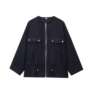 Detail of navy blue utility jacket showing drawstring waist, metal zipper, and size tag