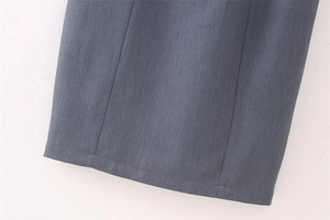 Detail view of the fine-textured pinstripe fabric and high-quality hem stitching