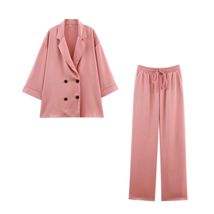 Pink two-piece set with double-breasted blazer top and drawstring pants in ribbed texture