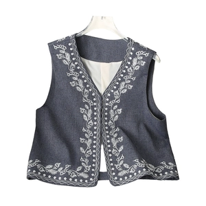 Women's vintage denim vest with elegant white floral embroidery and a stylish V-neck cut