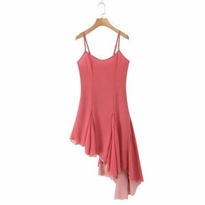 Detail of coral pink sleeveless chiffon dress with ruffled asymmetric hemline