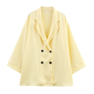 Light yellow double-breasted blazer with pleated texture and stylish black buttons