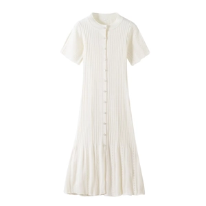 Close-up of cream knit dress with vertical ribbing, front buttons and a small size label