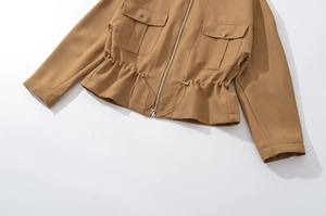 Detail of khaki cropped utility jacket featuring large flap pockets and drawstring hem